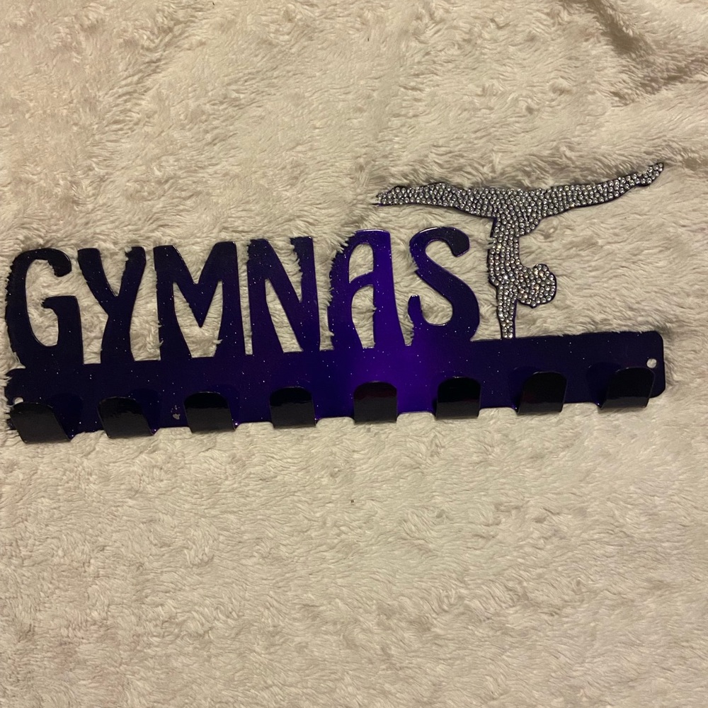 Gymnast medal display with hooks.